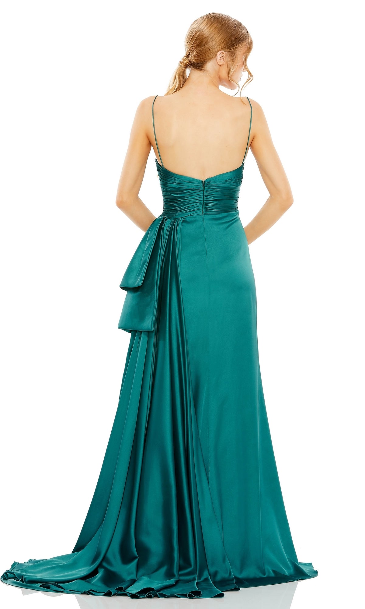 A woman stands with her back to the camera, wearing Mac Duggal's Long Formal Dress 68450—a floor-length teal satin gown with thin straps, a ruched sweetheart bodice, and a draped sash accent.